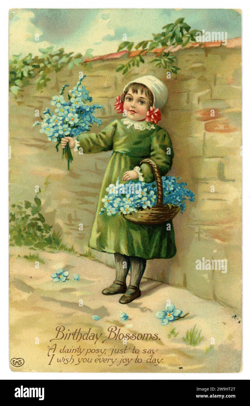 Original, charming Edwardian birthday greetings card of little girl holding basket of forget me nots., dated / posted Prestwich, U.K. 1910 Stock Photo