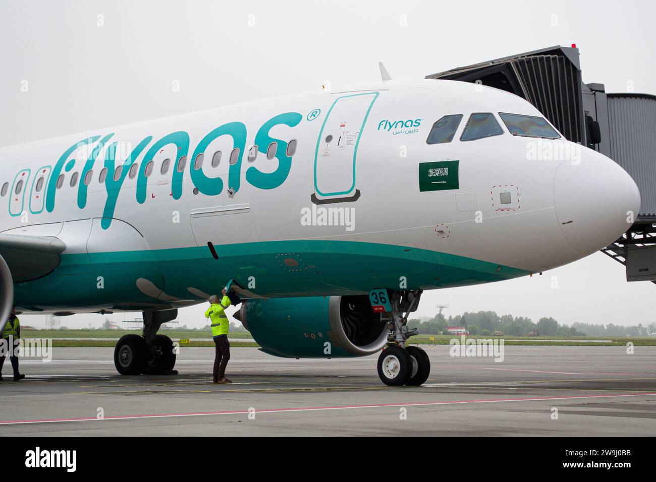 Flynas Airbus A320 NEO close-up while parked at gate after arriving to Lviv Airport from Riyadh Stock Photo