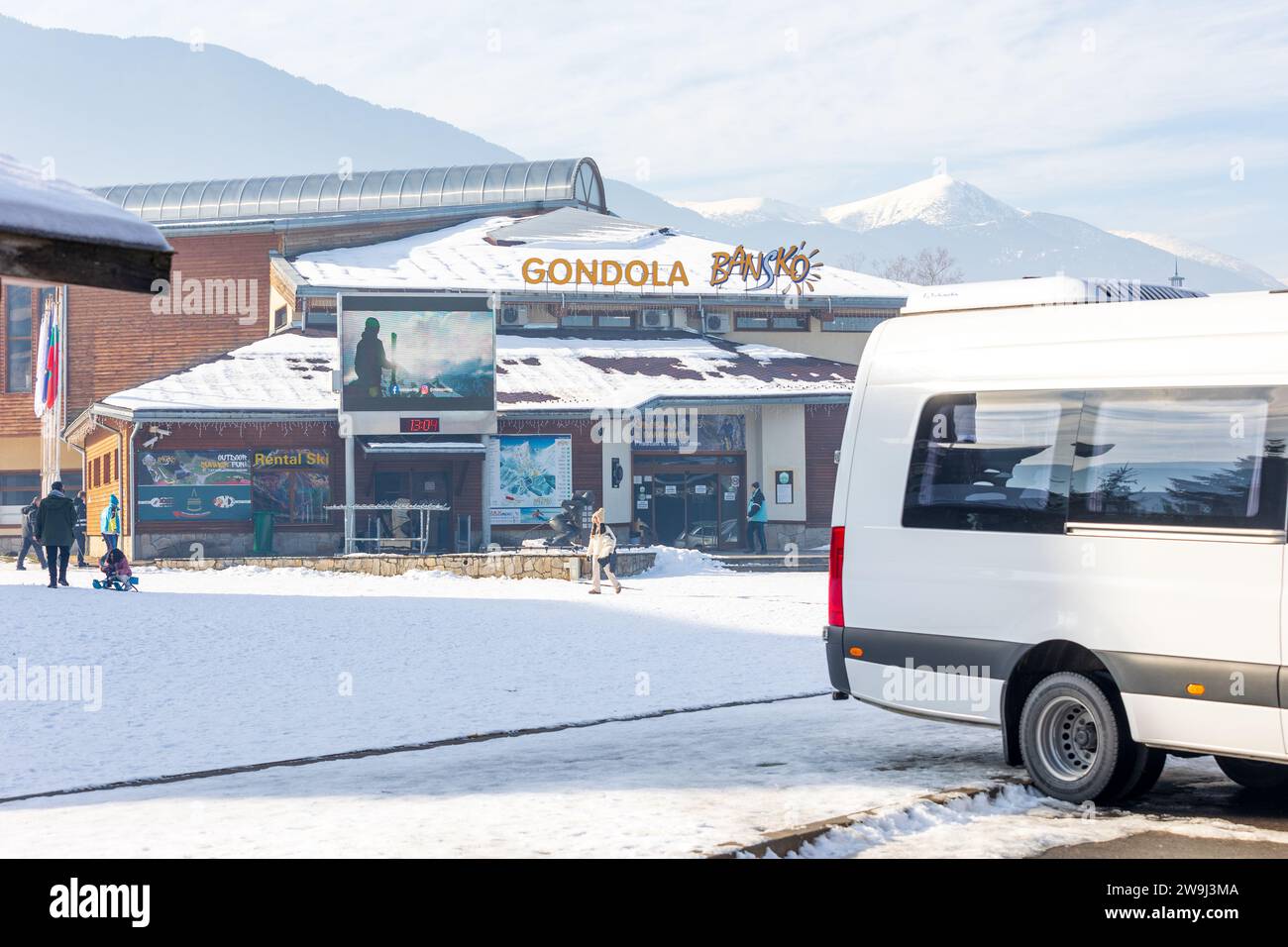 Bansko, Bulgaria - December 20, 2023: Bulgarian winter ski resort, entrance to gondola ski lift station and buses Stock Photo