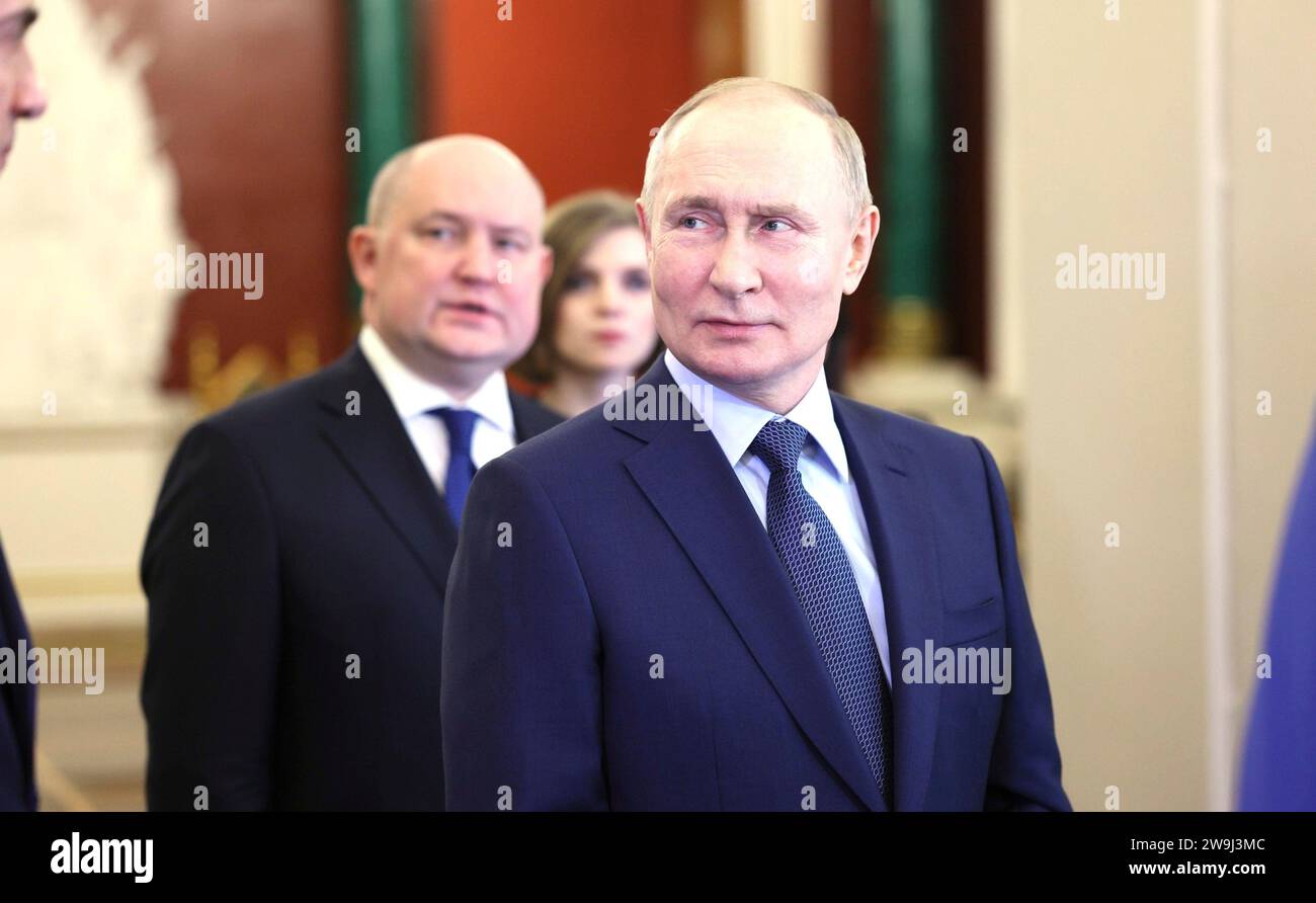 Moscow, Russia. 27th Dec, 2023. Russian President Vladimir Putin during a tour of an exhibition dedicated to the key events of the outgoing Year of Teachers and Mentors at the Kremlin, December 27, 2023 in Moscow, Russia. Credit: Gavriil Grigorov/Kremlin Pool/Alamy Live News Stock Photo