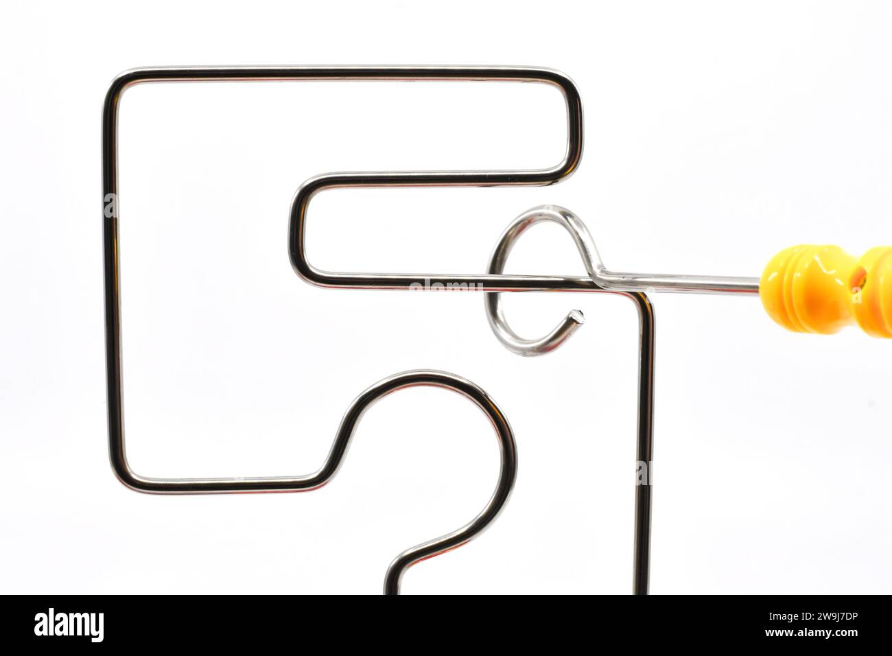 Small wand being moved around a wire frame game without touching the