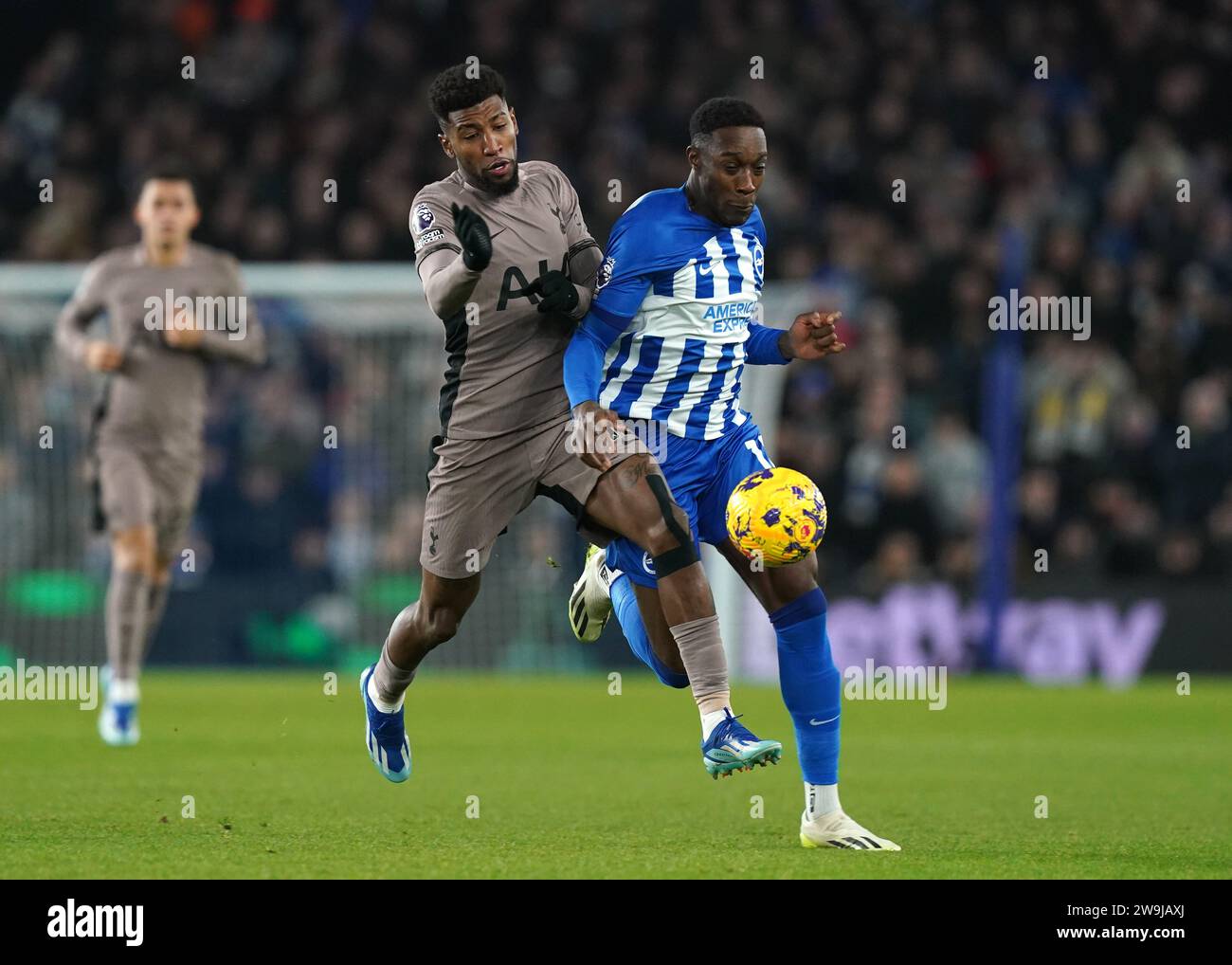 Tottenham Hotspur's Emerson (left) and Brighton and Hove Albion's Danny Welbeck battle for the ball during the Premier League match at the American Express Stadium, Brighton. Picture date: Thursday December 28, 2023. Stock Photo