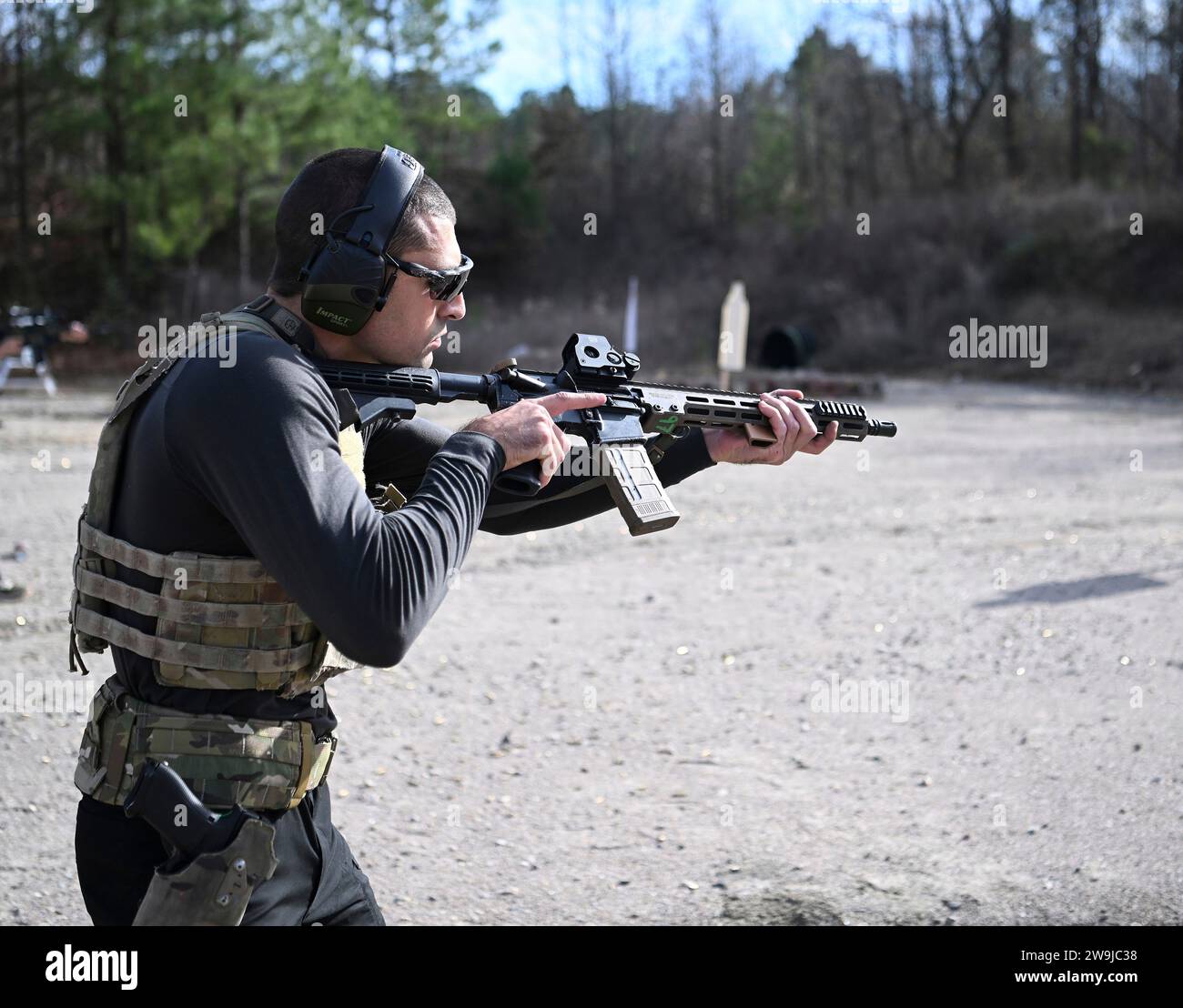 Fayetteville, United States of America. 13 December, 2023. Mixed Martial Artist Khonry Gracie, fires a rifle during practice prior to participating in the 2023 Green Beret Celebrity Tactical Challenge at the U.S. Army John F. Kennedy Special Warfare Center Miller Training Complex of Fort Liberty, December 13, 2023 Fayetteville, North Carolina. Fourteen celebrities teamed up with Green Berets to take part in the annual shooting event.  Credit: K. Kassens/US Army Photo/Alamy Live News Stock Photo