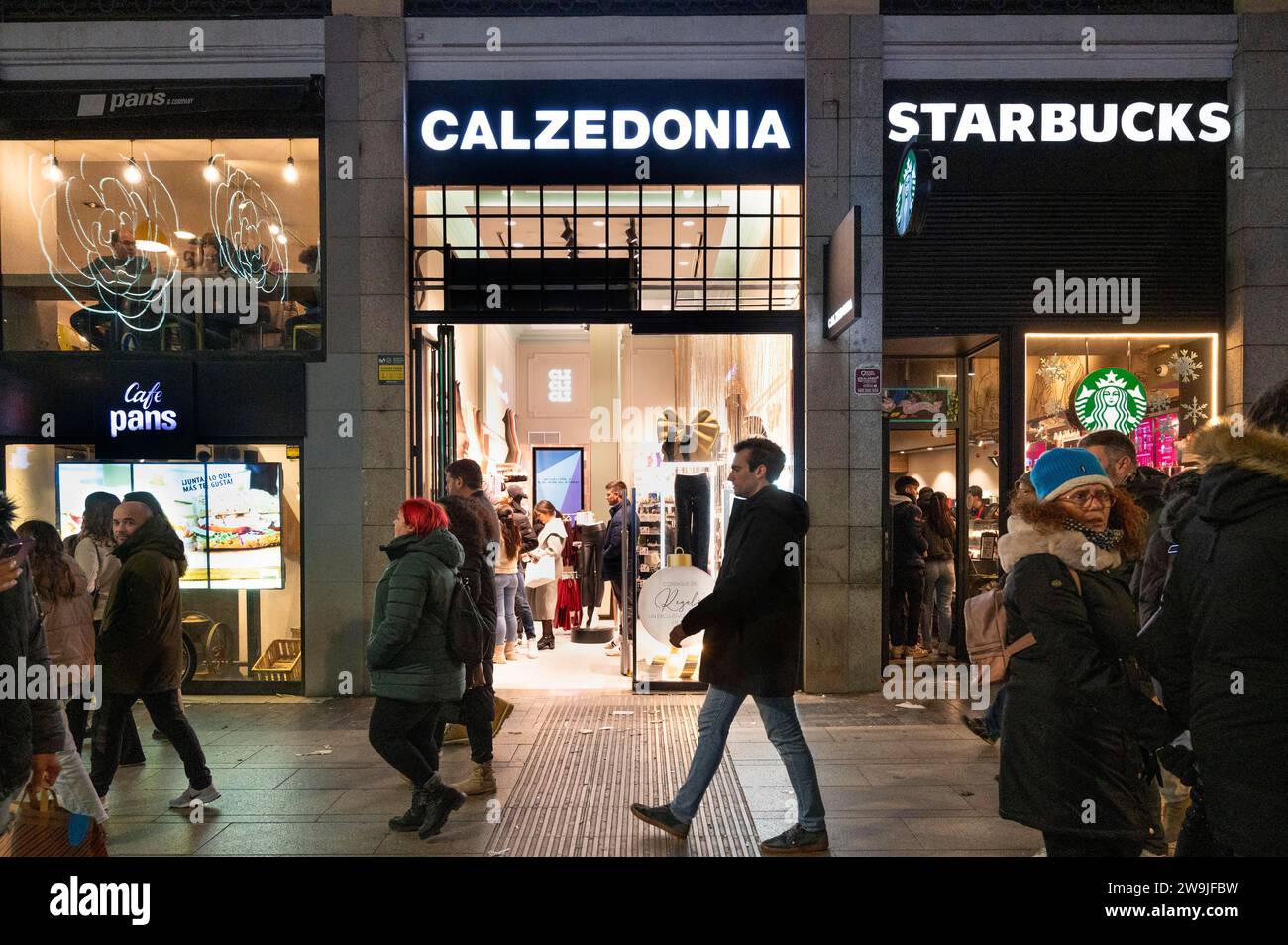Madrid, Spain. 9th Dec, 2023. Pedestrians walk past the Italian fashion