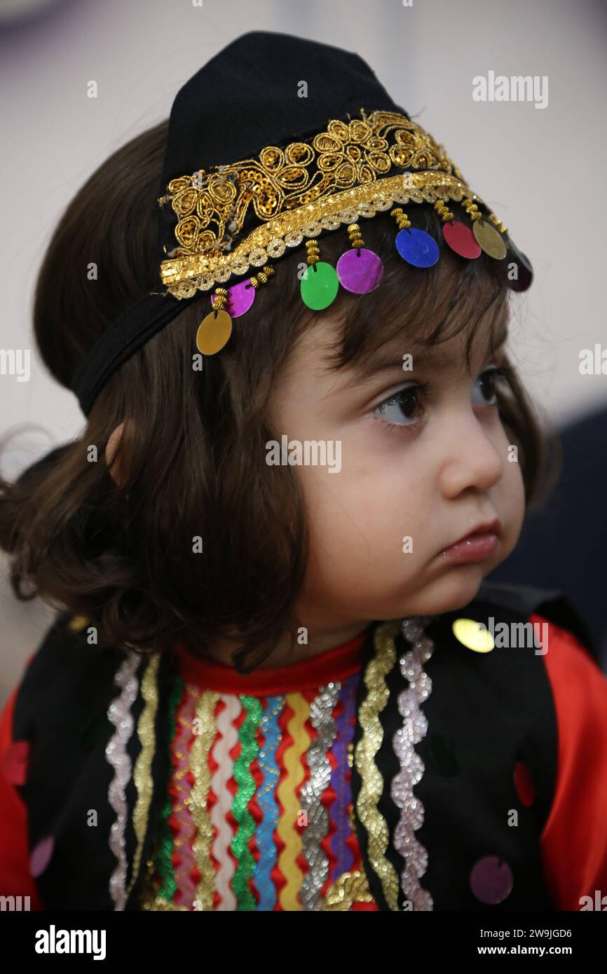 Rasht, Gilan, Iran. 28th Dec, 2023. An Iranian child girl wearing a traditional Gilani costume attends a food festival in Rasht. In 2015, the city of Rasht joined the network of creative cities of the world as a creative gastronomy city under the supervision of UNESCO. (Credit Image: © Rouzbeh Fouladi/ZUMA Press Wire) EDITORIAL USAGE ONLY! Not for Commercial USAGE! Stock Photo