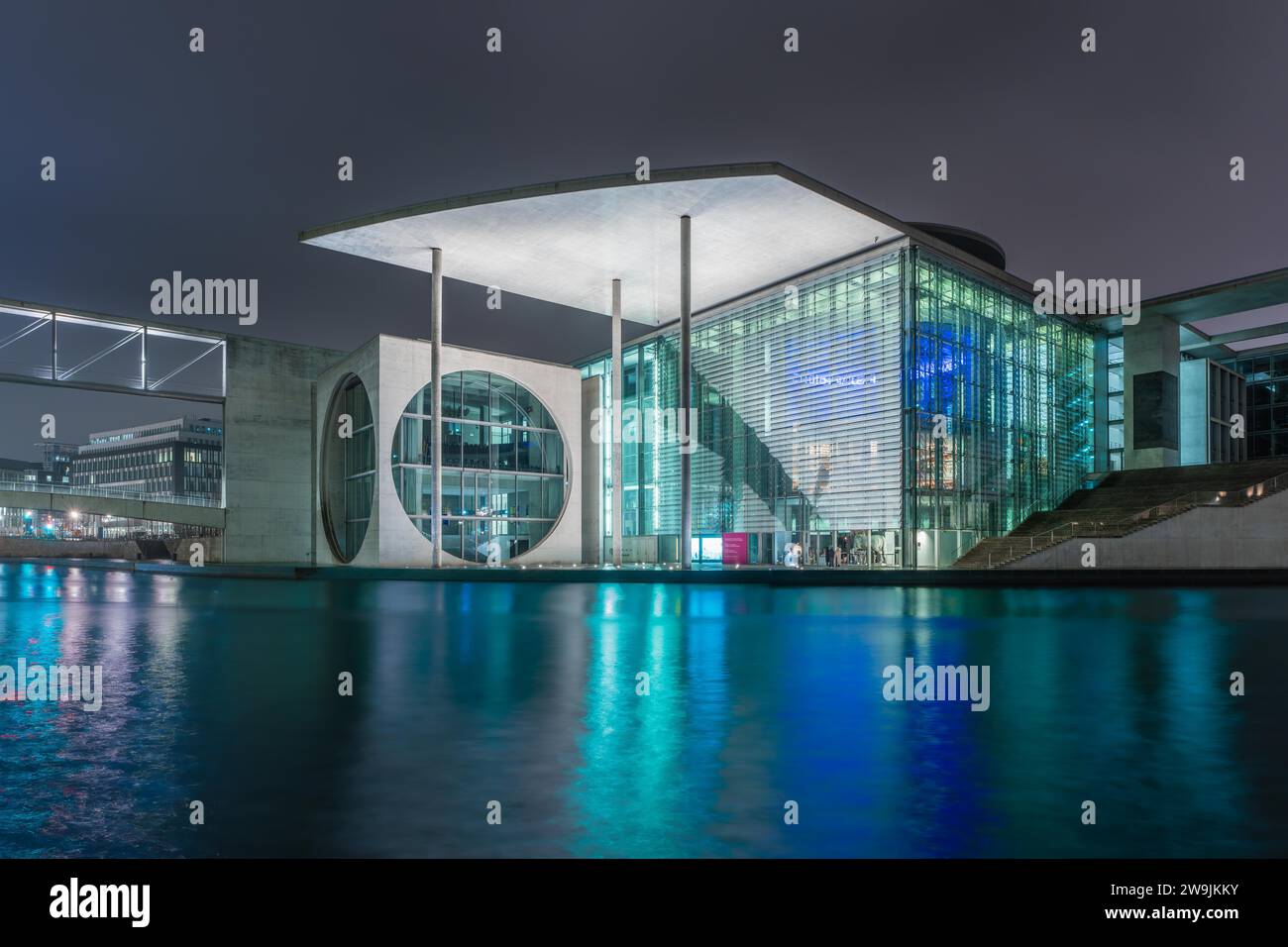 Night view of a government building with water reflection, Library of the German Bundestag, Berlin, Germany Stock Photo