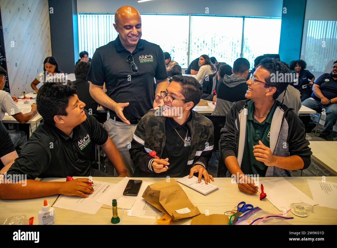 A teacher encourages multiracial college students experimenting with