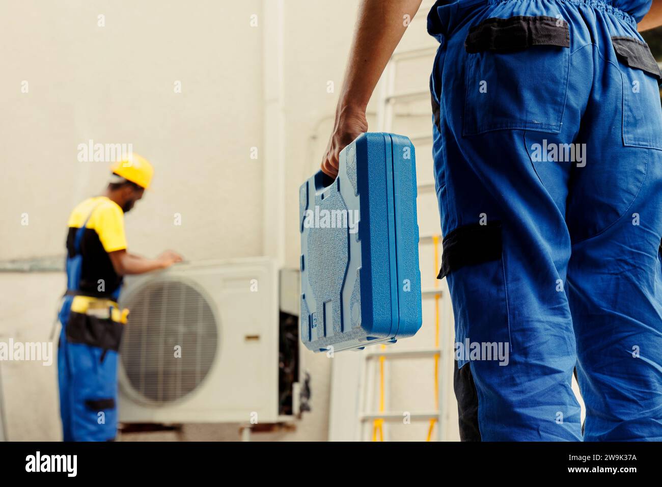 Electrician arriving on location to help wireman fix system electrical