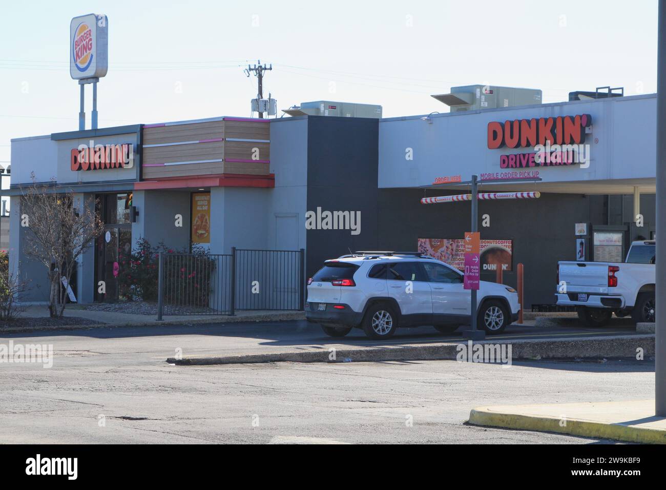 The drivethru and signage of a Dunkin' Donuts location in San Antonio