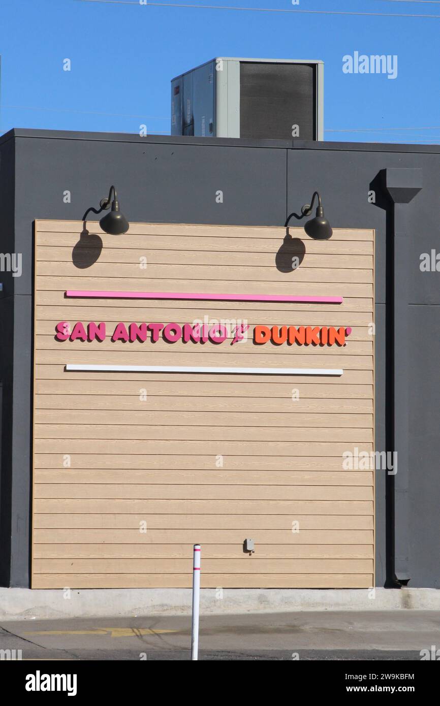 Exterior view and signage of a Dunkin' Donuts location in San Antonio, Texas, USA, on December