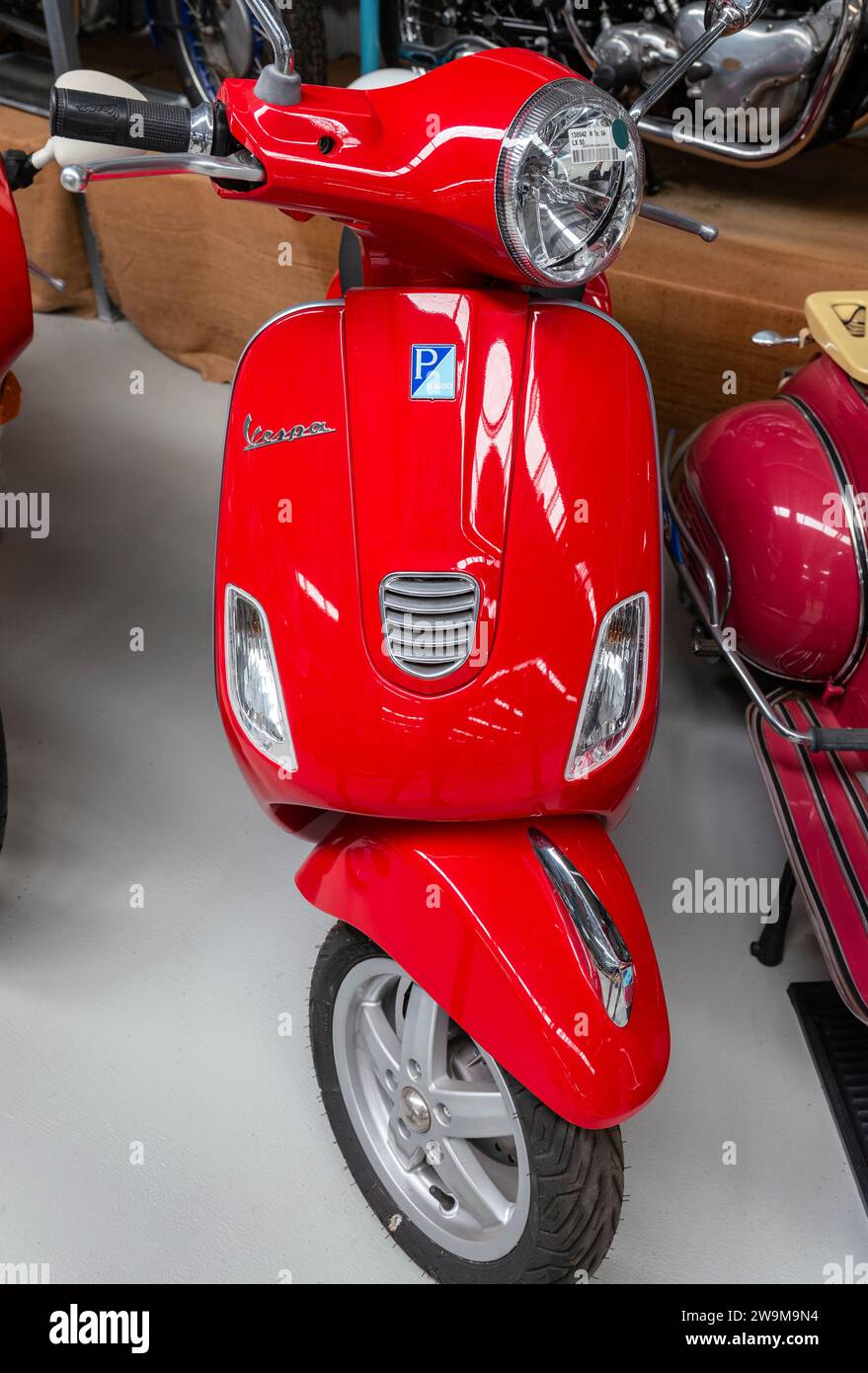 Red Vespa Piaggio LX 50 scooter Stock Photo