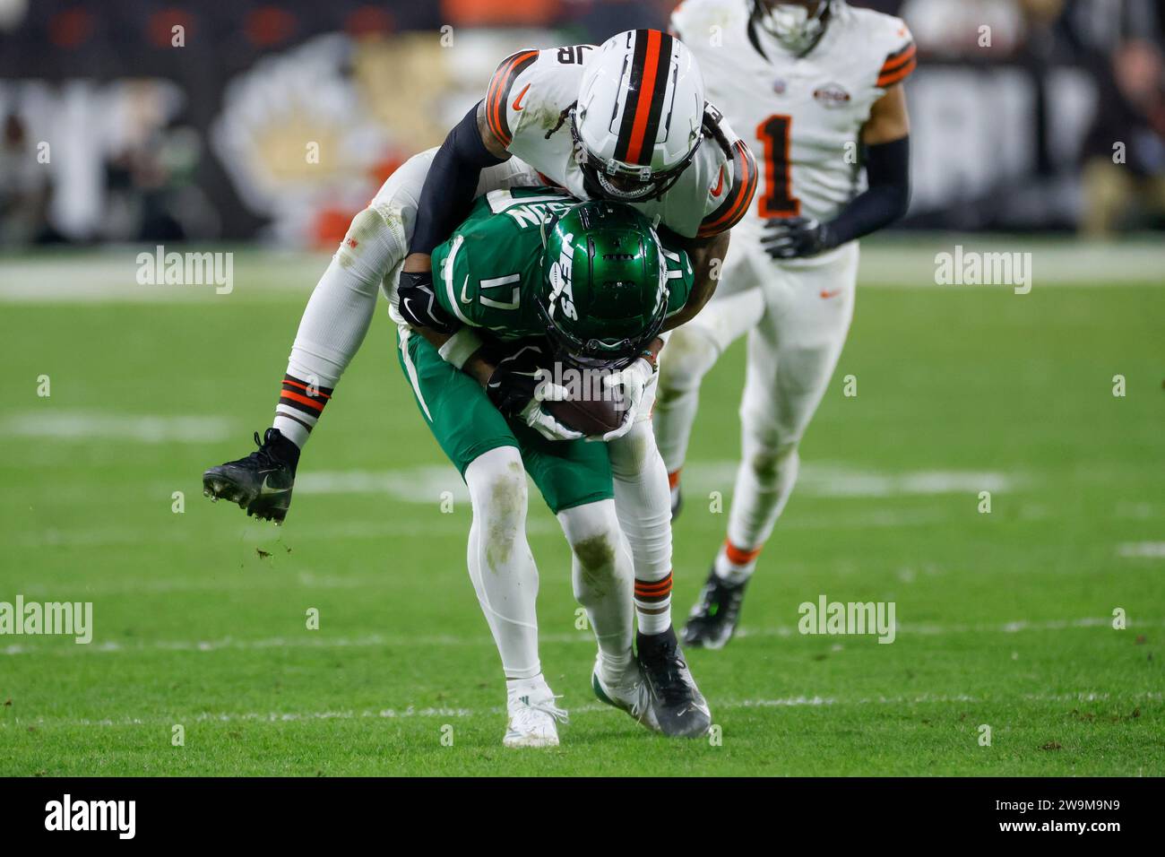 New York Jets wide receiver Garrett Wilson is tackled by Cleveland