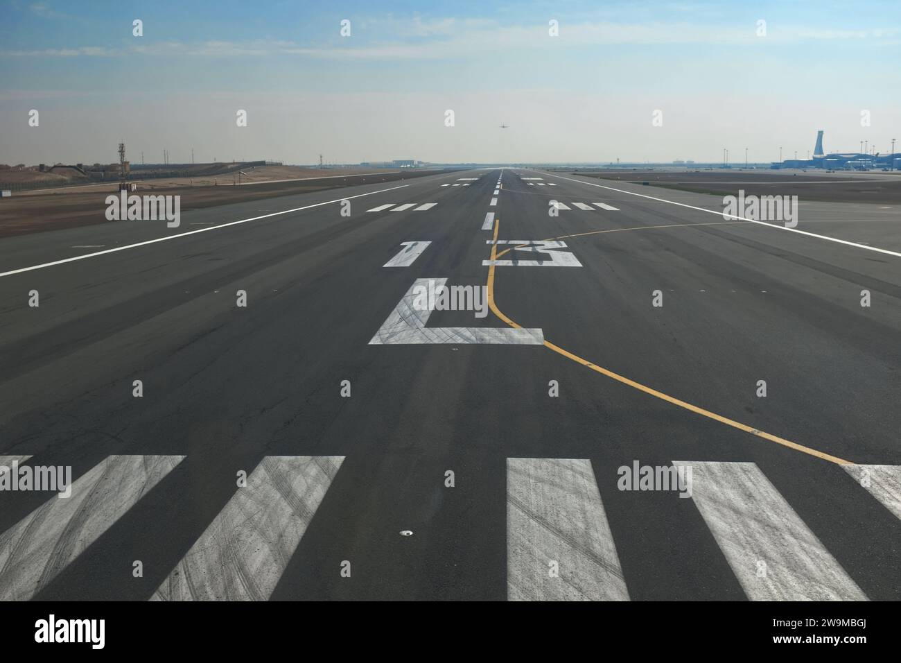 Air craft lining up on Runway 13 Left at Abu Dhabi airport , UAE Stock Photo