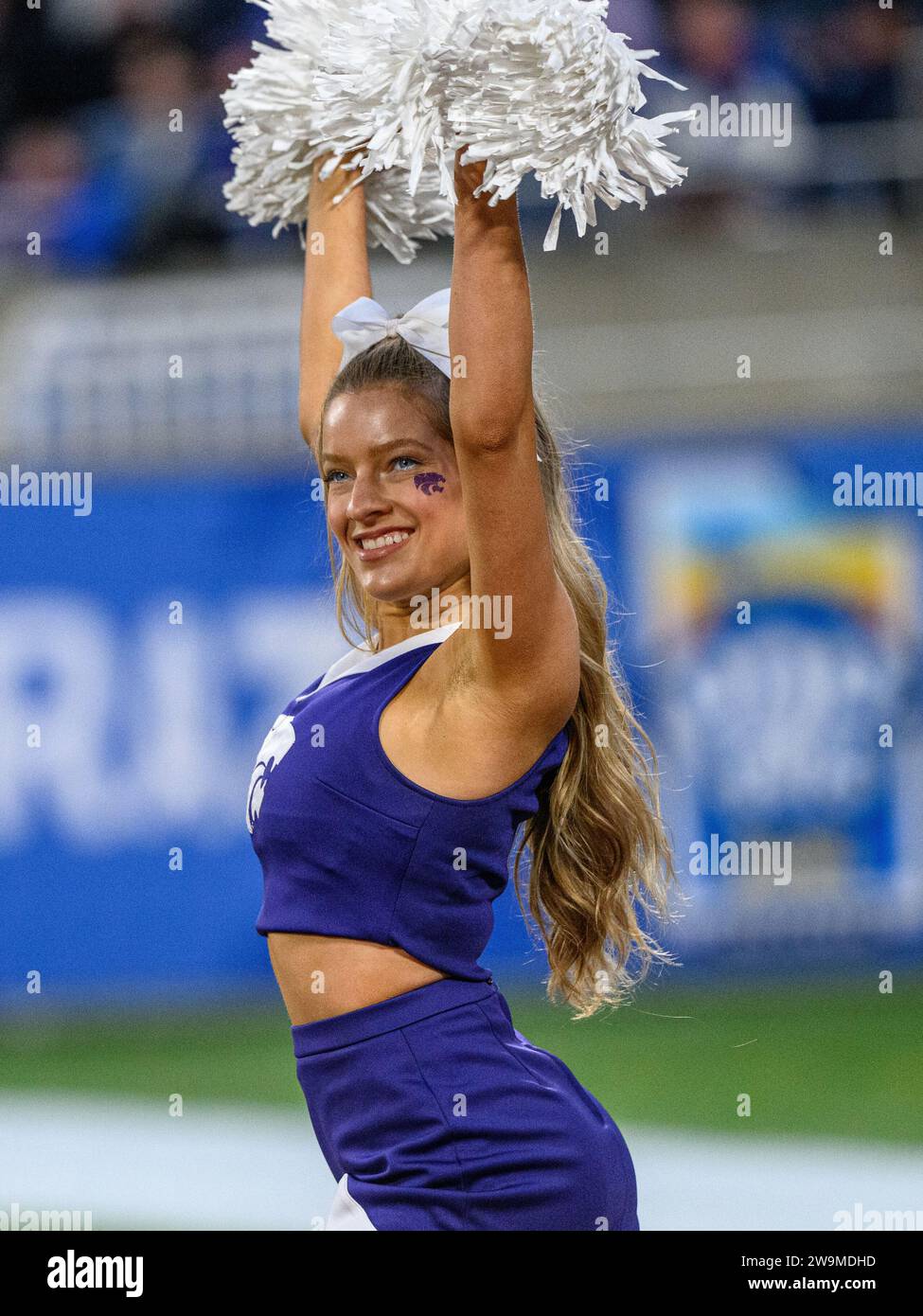 Orlando, FL, USA. 28th Dec, 2023. Kansas State cheer member performs before first half of the Pop Tarts Bowl in Orlando, FL. Romeo T Guzman/Cal Sport Media/Alamy Live News Stock Photo