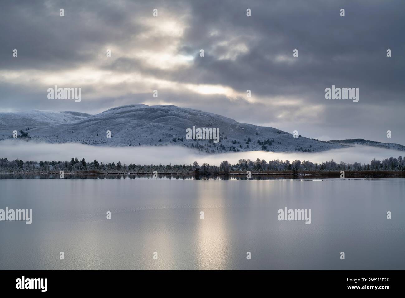 Loch Mallachie in the snow, mist and ice, Highlands, Scotland Stock Photo