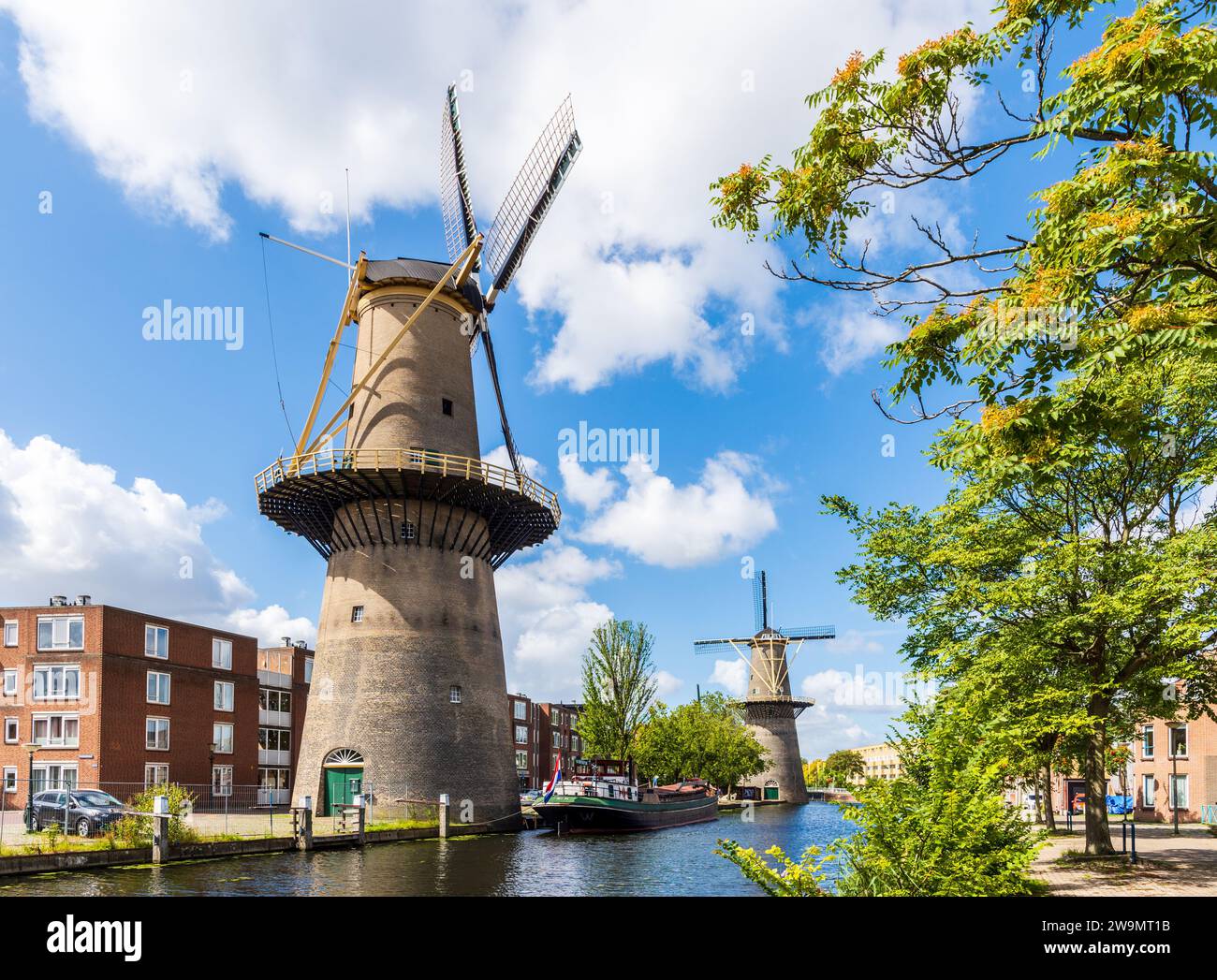 The Palmboom and the Noord city mills are part of the Schiedam windmills near Rotterdam, Netherlands, the tallest classic windmills in the world. Stock Photo