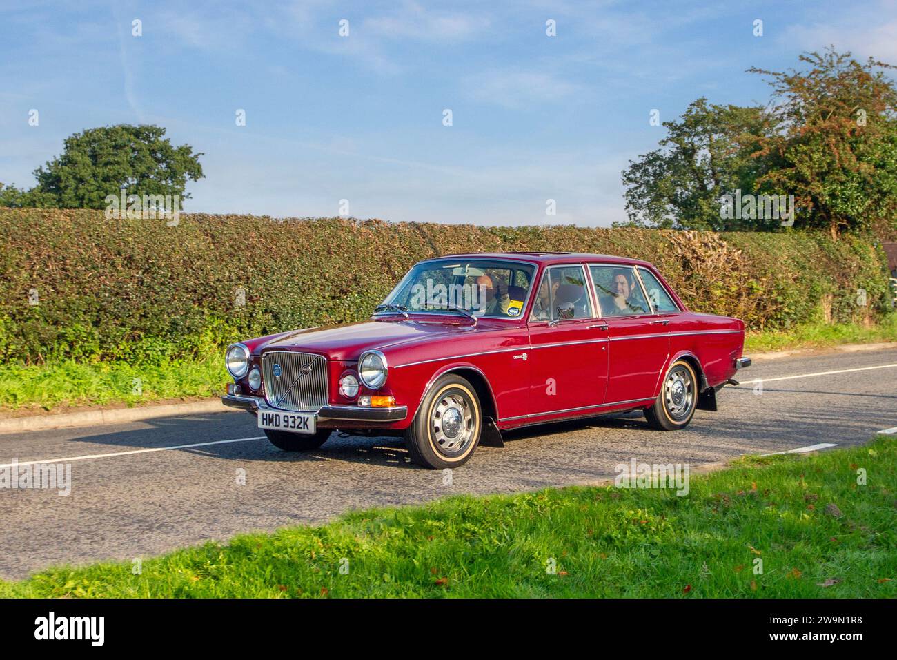 1971 70s seventies Volvo 164 Maroon Petrol 2978 cc, 4-door, 6-cylinder luxury sedan, 3.0 l. Cylinders. 6 Cyl ;  en-route to Capesthorne Hall classic August car show, Cheshire, UK Stock Photo