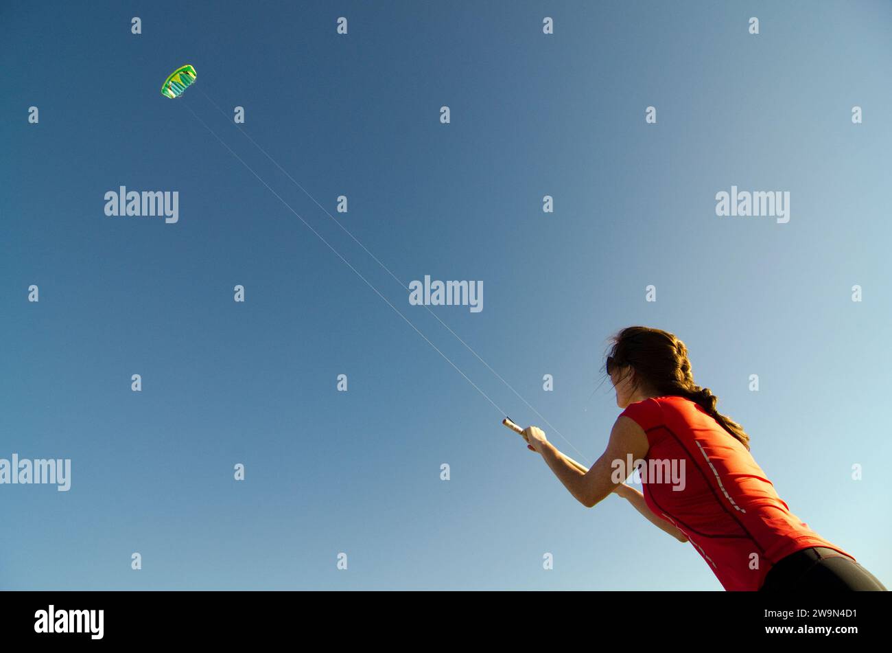 A woman flies her stunt kite on the beach on Hilton Head Island, SC