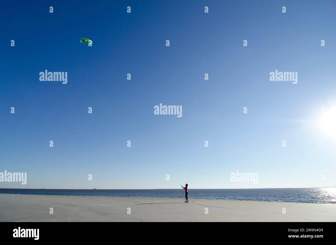 A woman flies her stunt kite on the beach on Hilton Head Island, SC