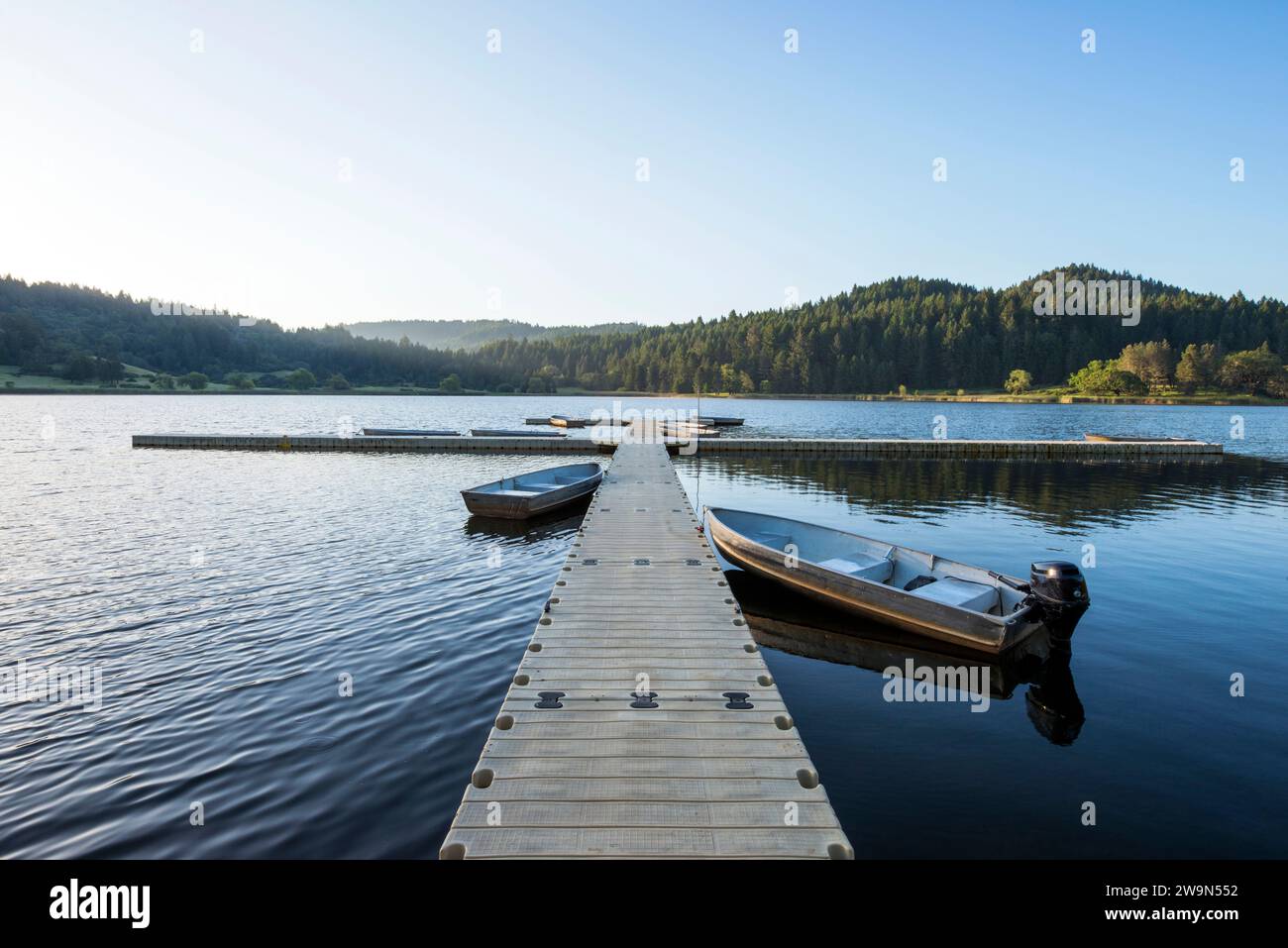 Boats docked at sunrise on Lake Winawa at the Wente Scout Reservation