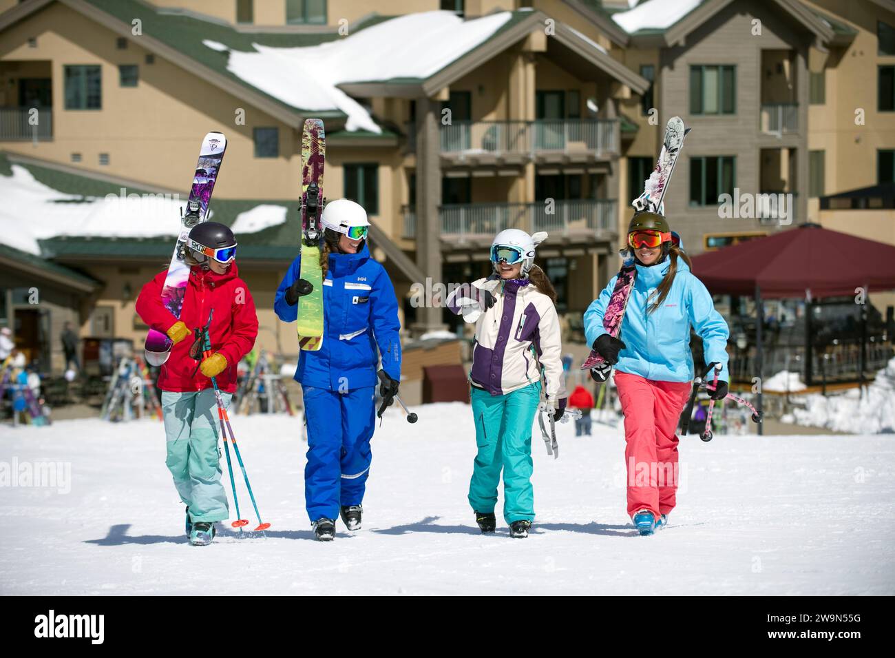 A group of skiers walk with their ski instructor in the village at Kirkwood Mountain Resort in Kirkwood, California. Stock Photo