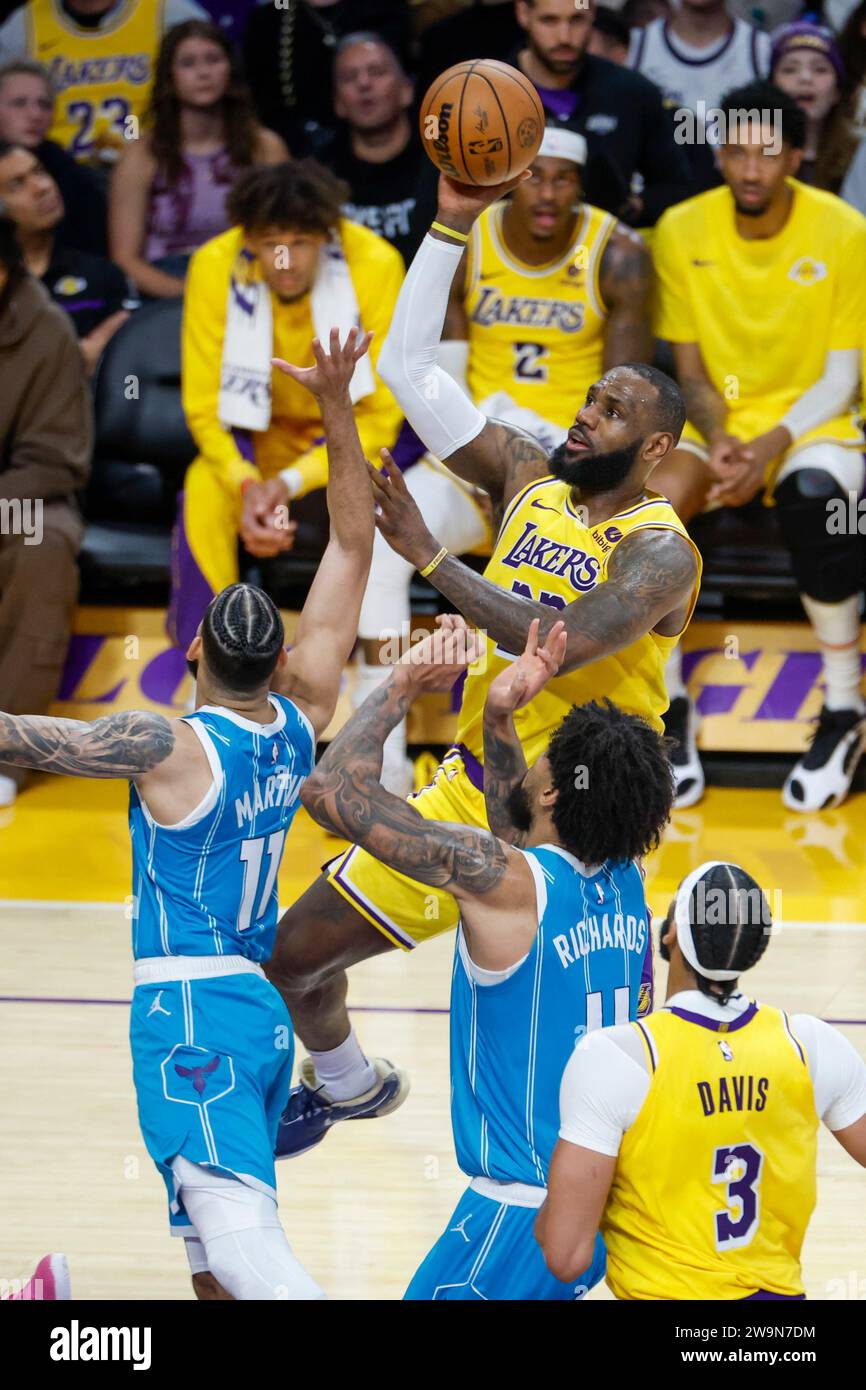 Los Angeles, United States. 28th Dec, 2023. Los Angeles Lakers' LeBron James (TOP) shoots against the Charlotte Hornets during an NBA basketball game at Crypto.com Arena in Los Angeles. Final score; Lakers 133:112 Hornets Credit: SOPA Images Limited/Alamy Live News Stock Photo