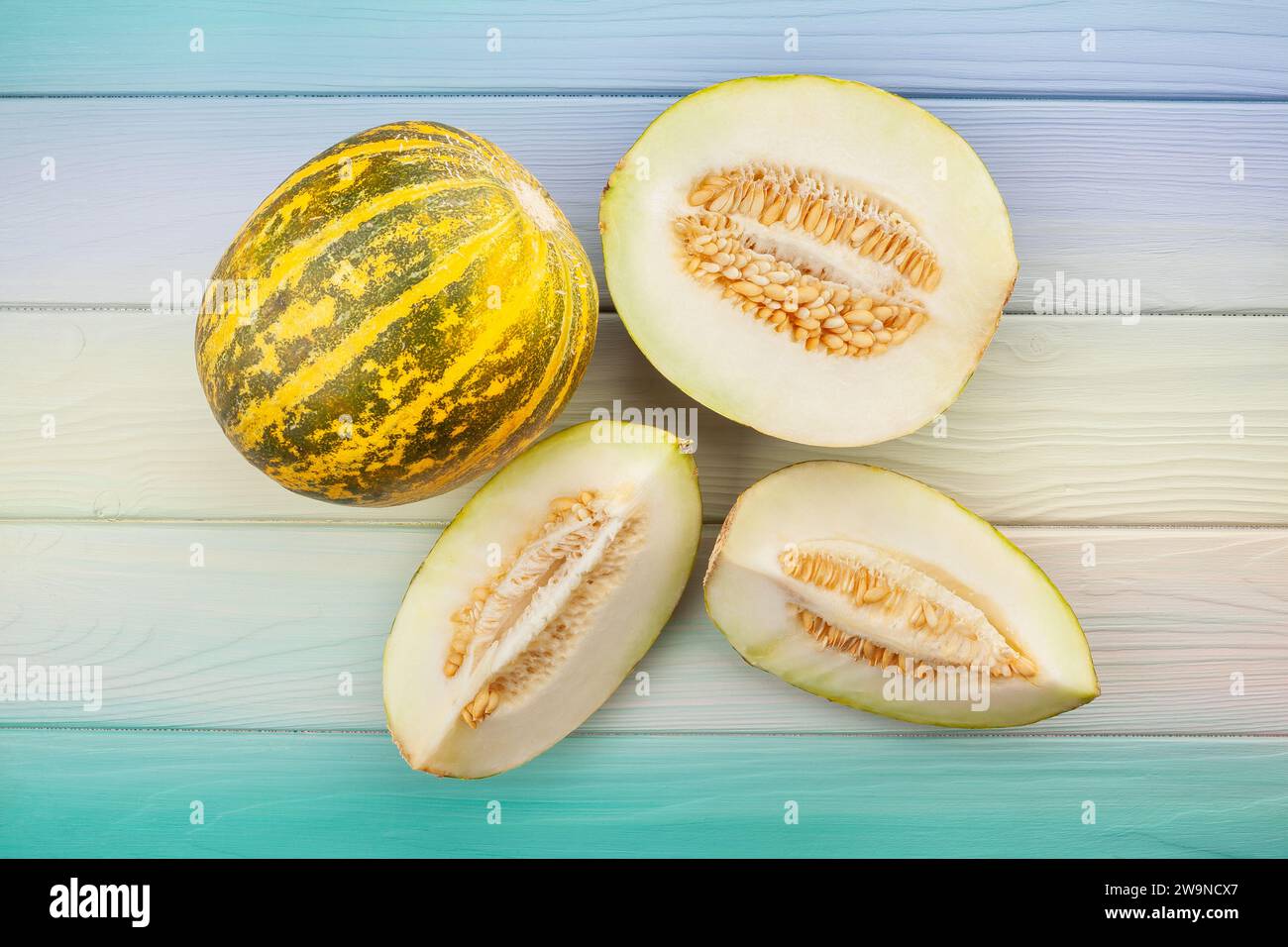 sliced melon on wood background top view Stock Photo