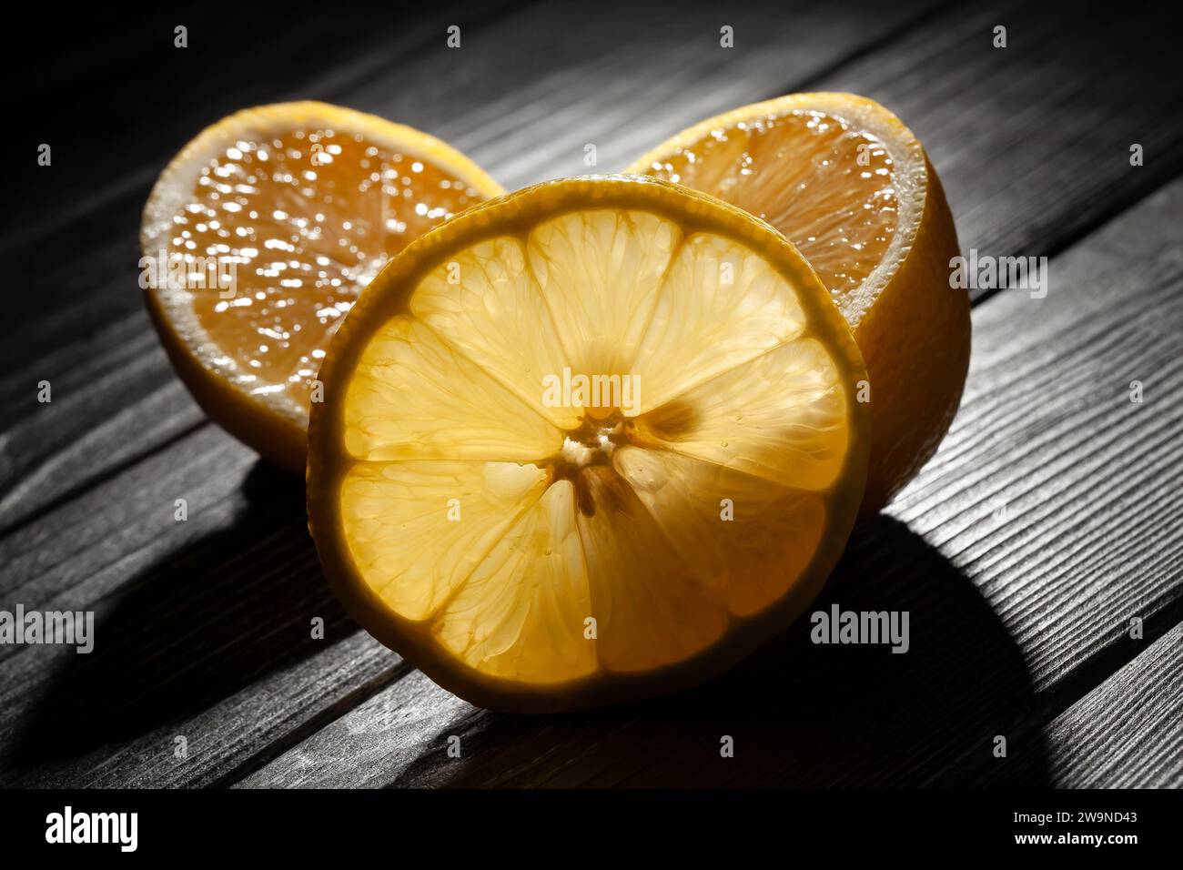 sliced lemon on wood background Stock Photo