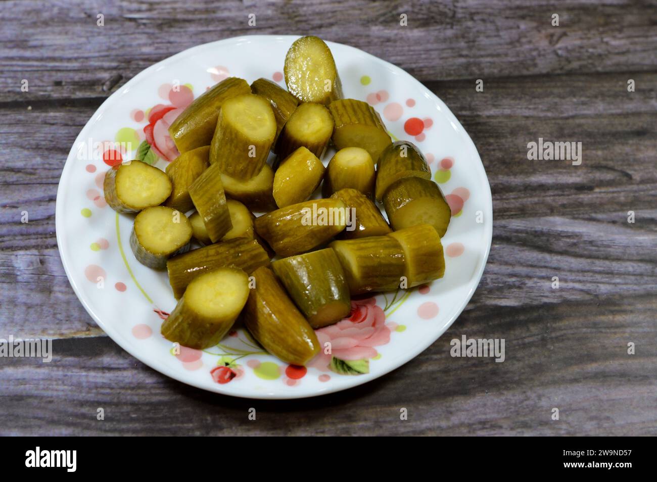 Slices of pickled cucumber, pickle, gherkin, usually small or miniature