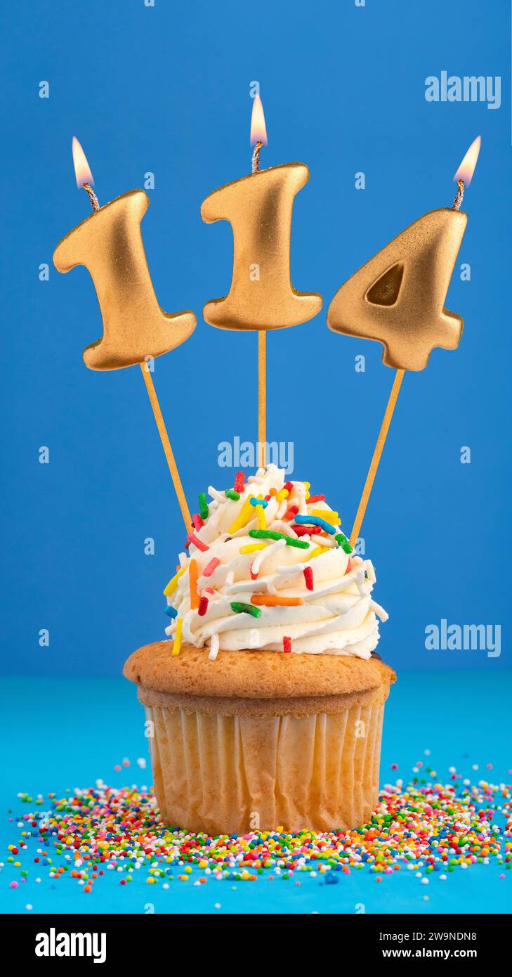 Birthday cake with candle number 114 - Blue background Stock Photo - Alamy