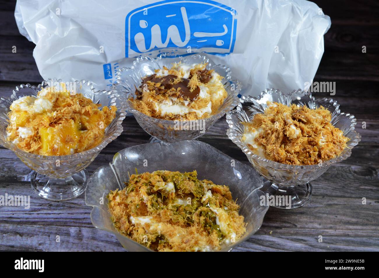 Cairo, Egypt, December 18 2023: Sweet Koshary from B.Laban made of layers, rice with milk sweet pudding, whipped cream, toasted Konafa and phyllo filo Stock Photo