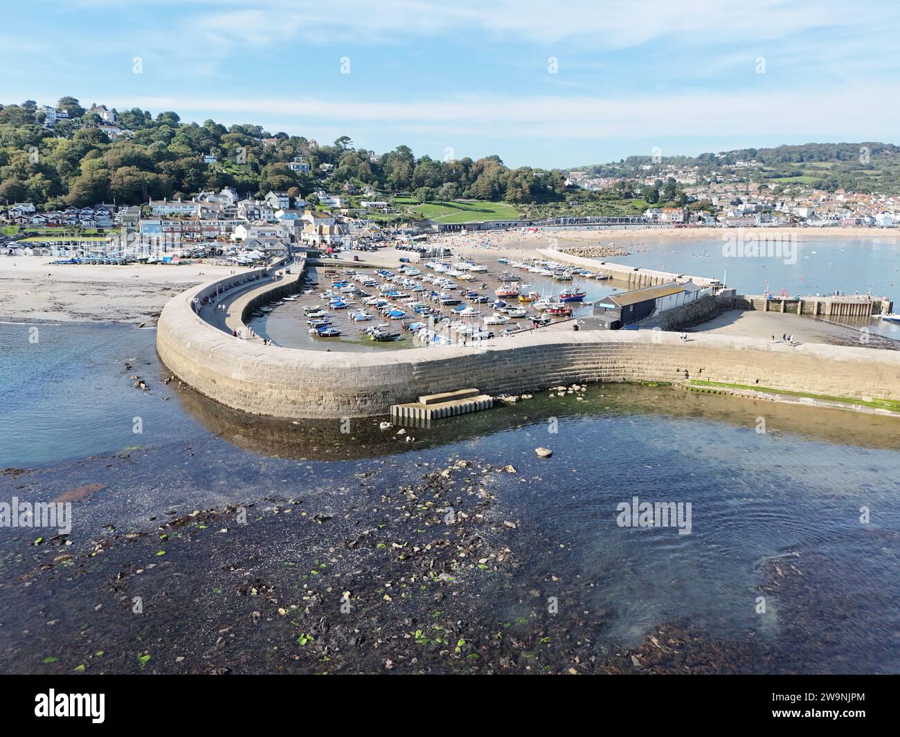 Lyme Regis Dorset UK the Cobb harbour wall  summer drone,aerial Stock Photo