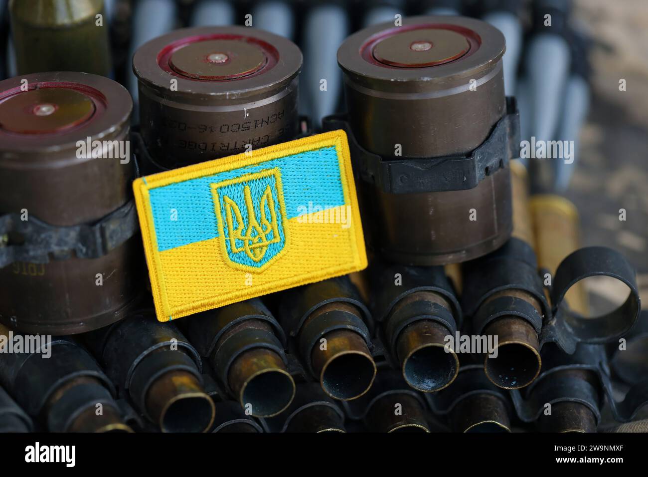 Ukrainian symbol on machine gun belt lies on ukrainian pixeled military ...