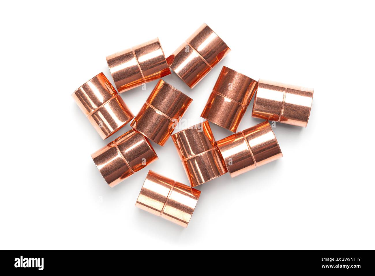 Copper sleeves, weld-in sockets, soldering fittings, and connectors for installation on copper pipes, for use in plumbing or mechanical applications. Stock Photo