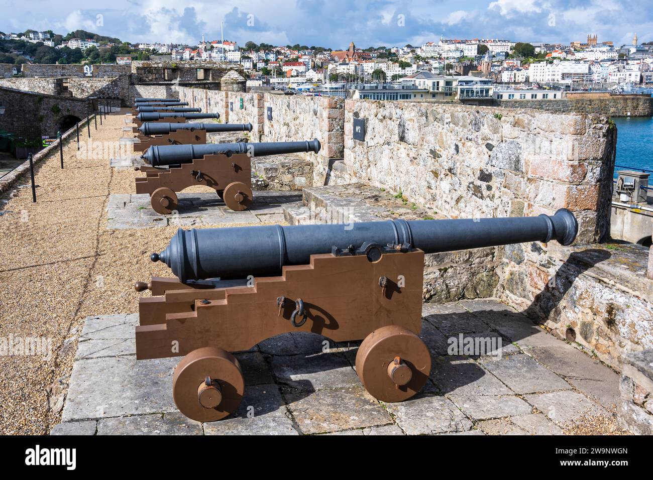 Replica Saker cannons on the Saluting Battery overlooking St Peter Port harbour in Castle Cornet, St Peter Port, Guernsey, Channel Islands Stock Photo