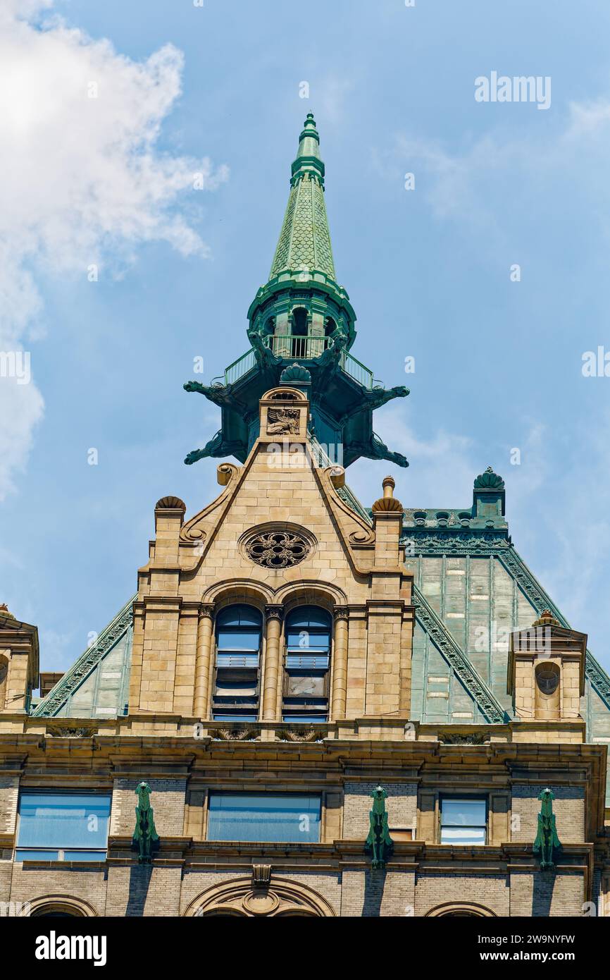 Copper-clad roof, cupola, and winged gargoyles crown the Sherry-Netherland, a 1927 hotel now primarily condominium residences at 781 Fifth Avenue. Stock Photo