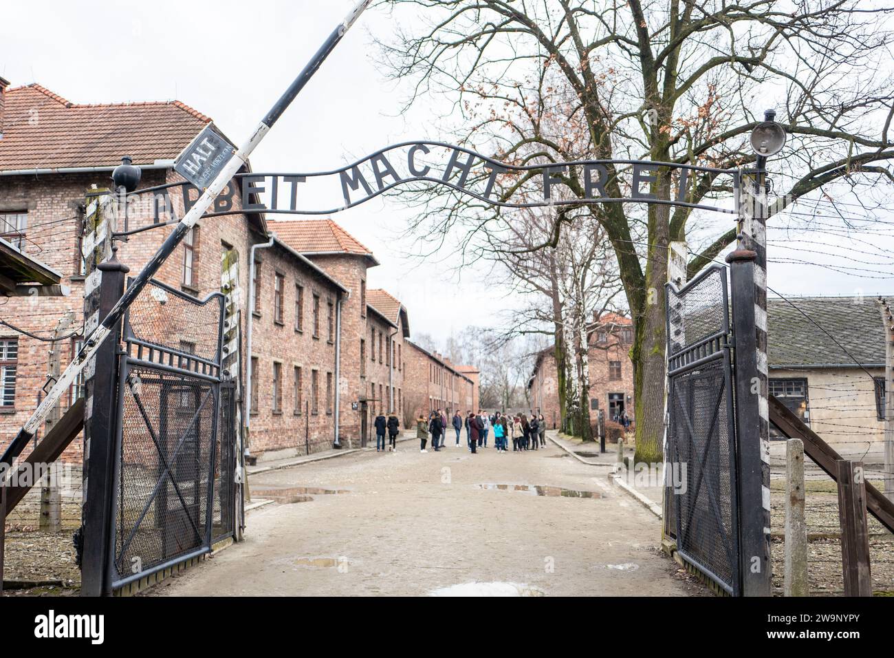 The motto above the gate to Auschwitz concentration camp, 'Arbeit macht frei' (Work Sets You Free). Stock Photo