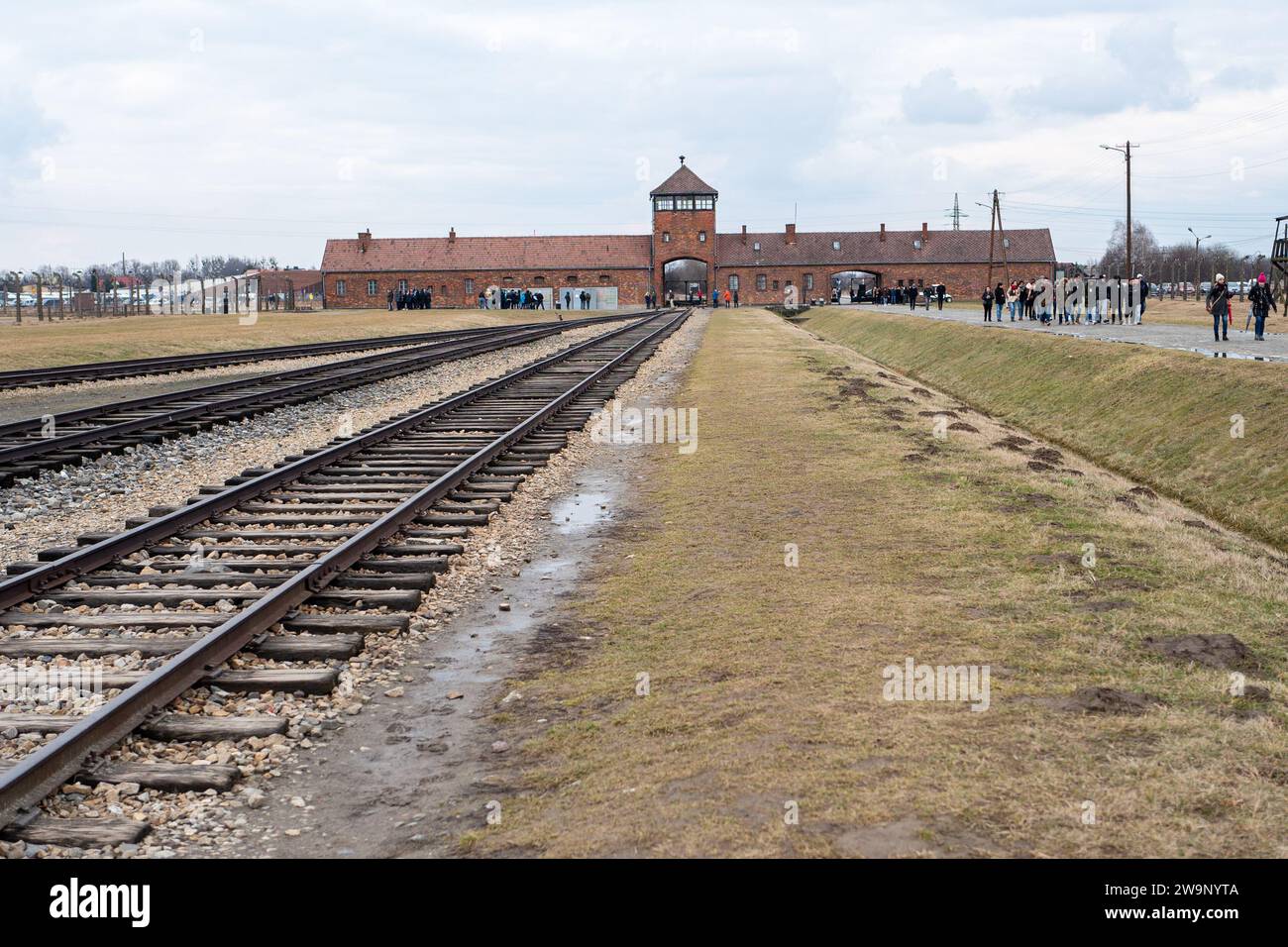 Rail tracks and entry to Auschwitz  Birkenau concentration camps, Poland Stock Photo