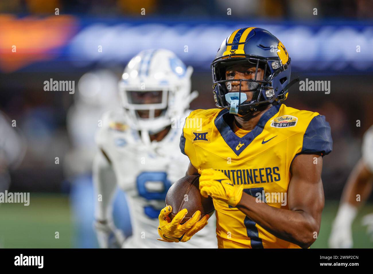 Dec 27, 2023; Charlotte, NC, USA;  West Virginia Mountaineers cornerback Andrew Wilson-Lamp (7) runs with the ball during the Duke’s Mayo Bowl against Stock Photo