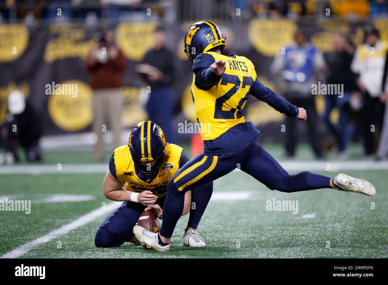 Dec 27, 2023; Charlotte, NC, USA;  West Virginia Mountaineers place kicker Michael Hayes (22) adds the extra point during the Duke’s Mayo Bowl against Stock Photo