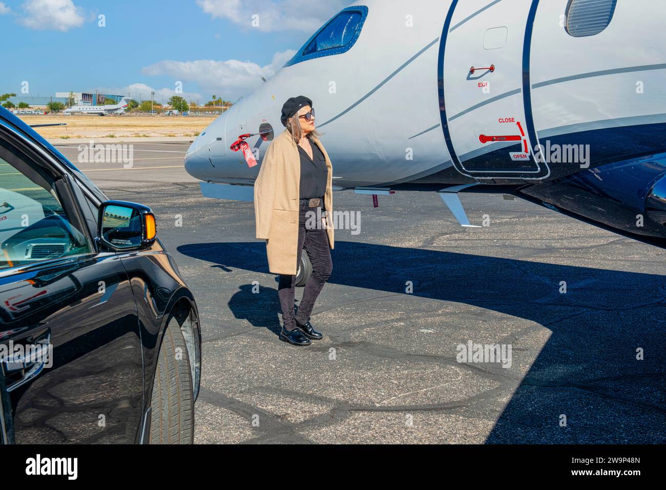 First World problem - VIP person waits outside a locked private jet as the Pilot is late. Stock Photo