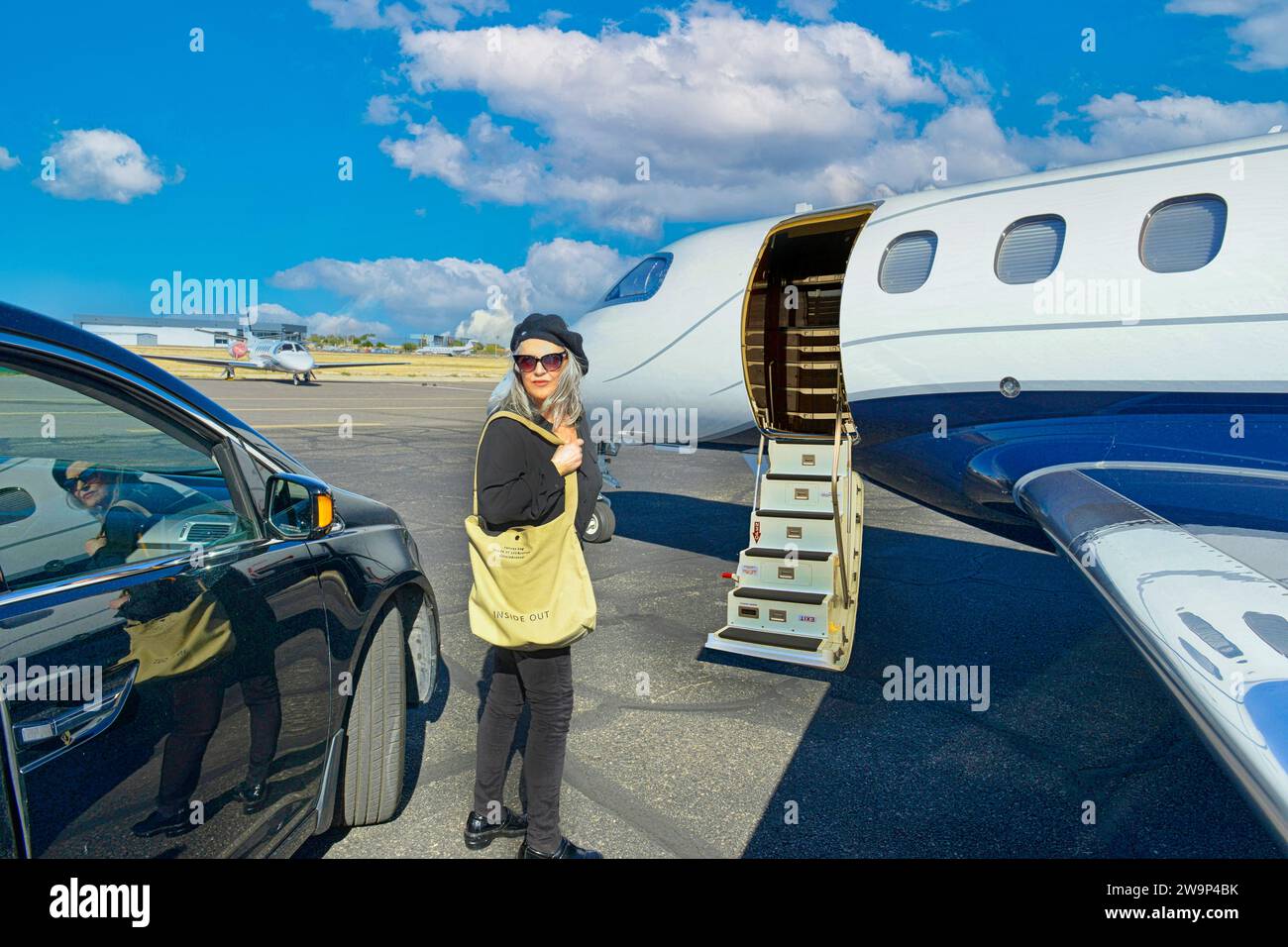 First World problem - VIP person waits outside a locked private jet as the Pilot is late. Stock Photo