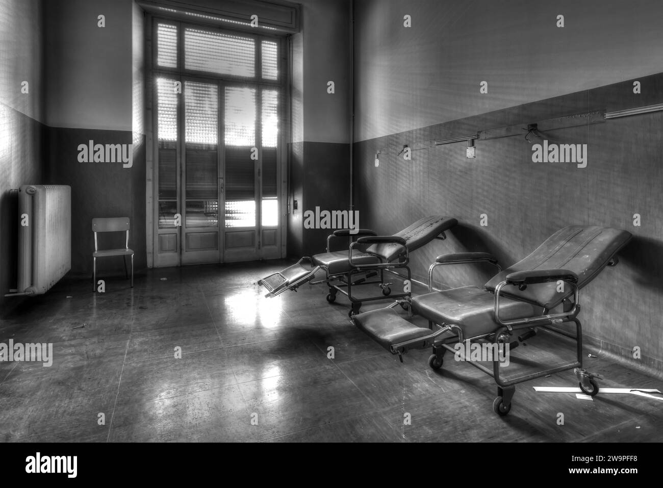 December 10, 2023, Room of an abandoned hospital, with beds and medical equipment Stock Photo