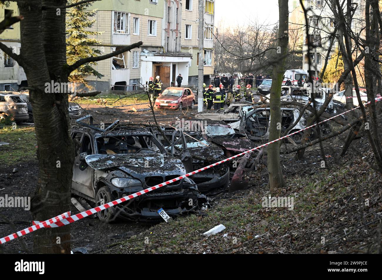 Lviv, Ukraine - December 29, 2023: Destroyed private cars at the site of a Russian missile strike in city of Lviv. Stock Photo