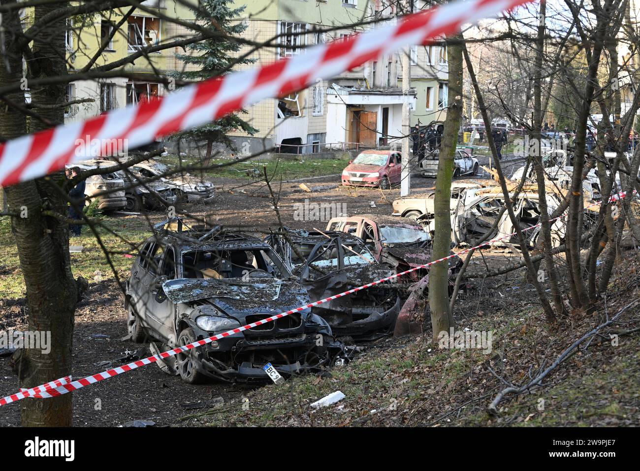 Lviv, Ukraine - December 29, 2023: Destroyed private cars at the site of a Russian missile strike in city of Lviv. Stock Photo