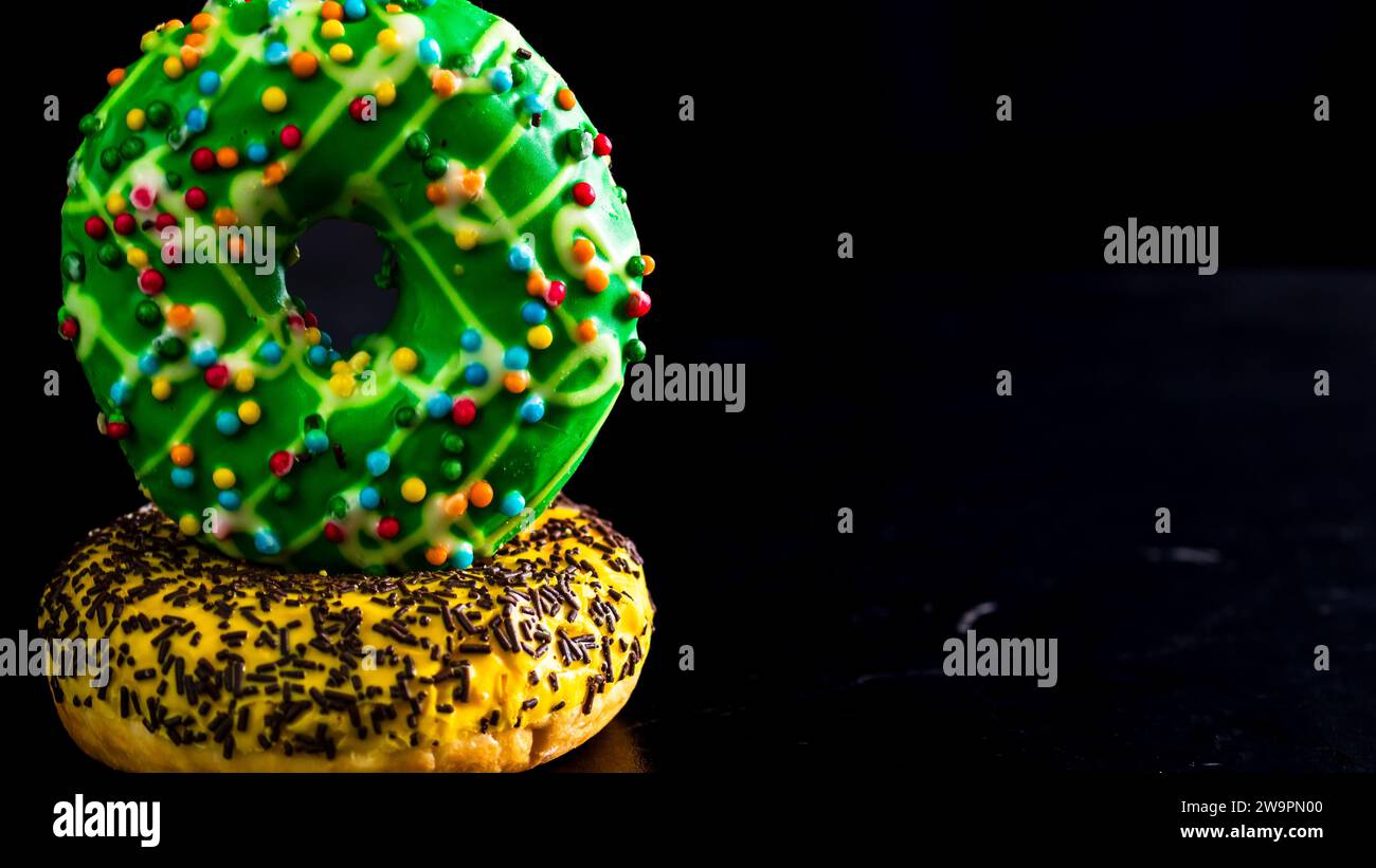 Glazed donuts with sprinkles isolated. Close up of colorful donuts ...