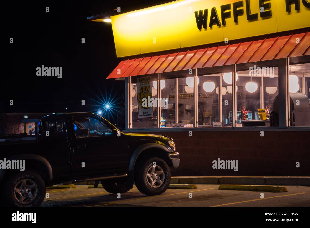 Calvert City, KY, US-December 2, 2021 : Waffle House exterior at night. Waffle House, is an iconic restaurant chain with more than 2,100 locations in Stock Photo