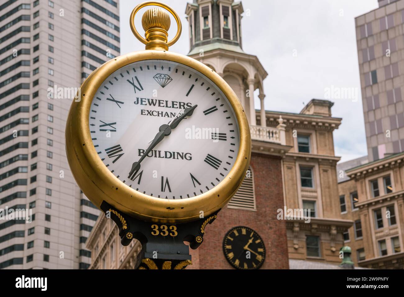 Boston, MA, USJune 30, 2023 Old fashioned clock reading Jewelers Exchange on street in