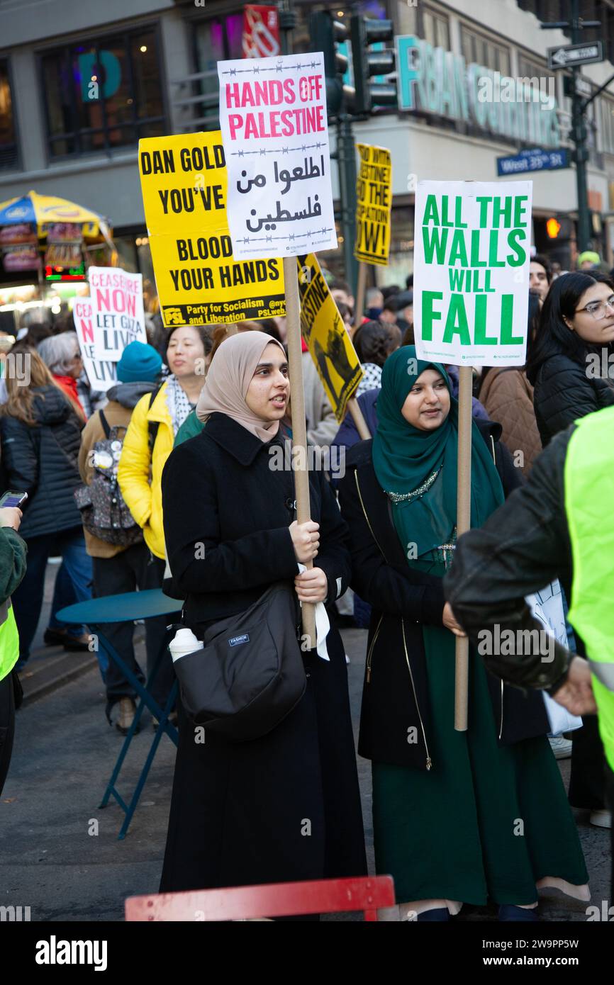 Pro Palestinian rally and demonstration in Herald Square by Macy's in Manhattan two months into the bombing of Gaza after the October 7th 2023 Hamas attack in Israel. Stock Photo