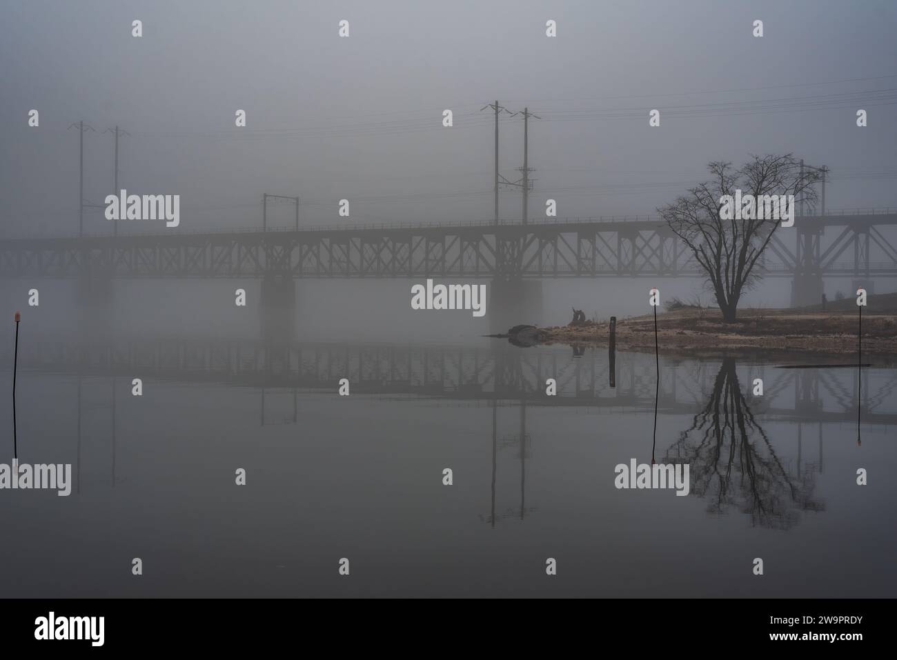 Susquehanna River Rail Bridge on a Foggy Evening, Havre de Grace Maryland USA Stock Photo
